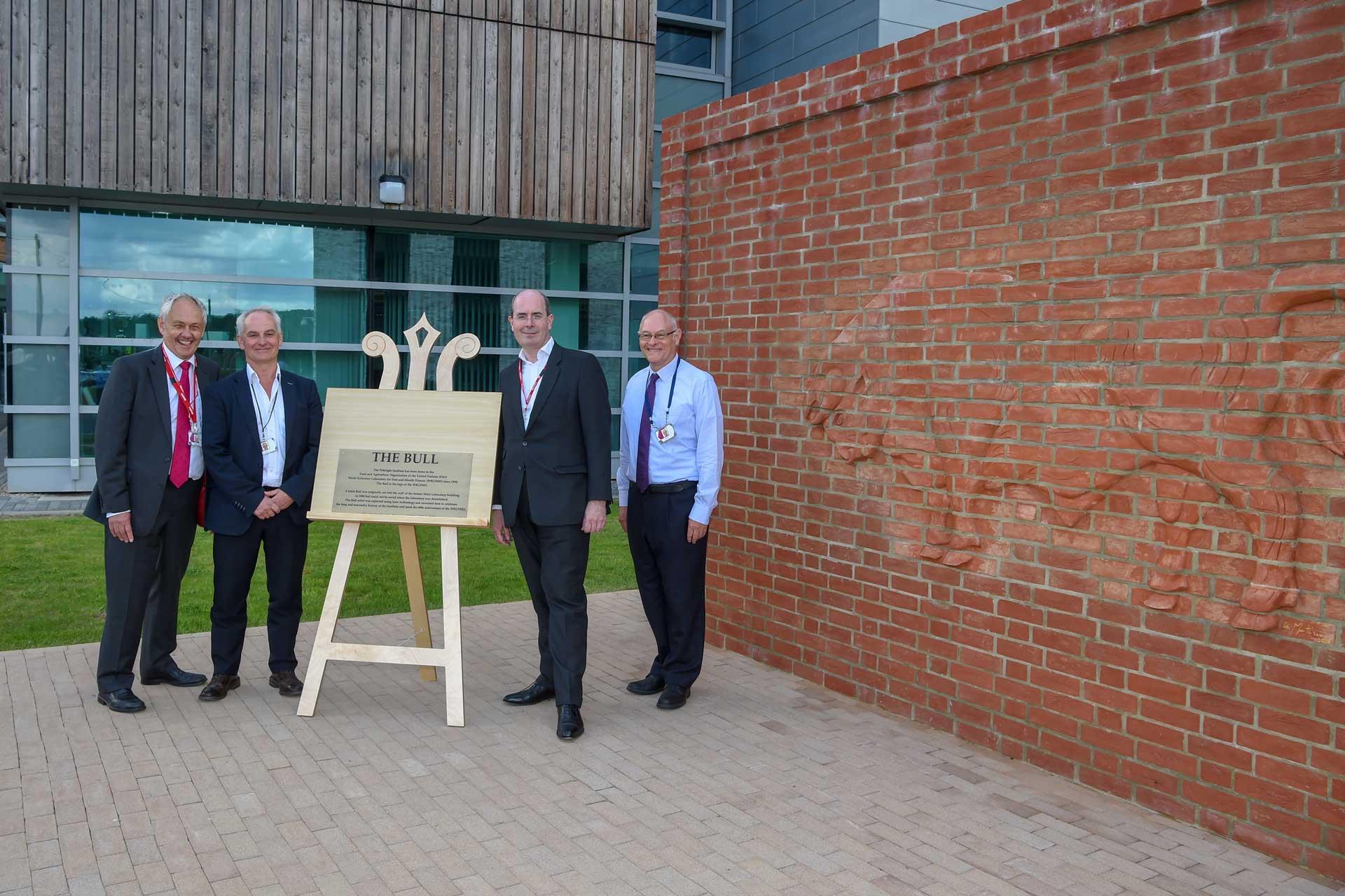 Sir John Kingman unveilling the brick bull in celebration of WLRFMD 60 years